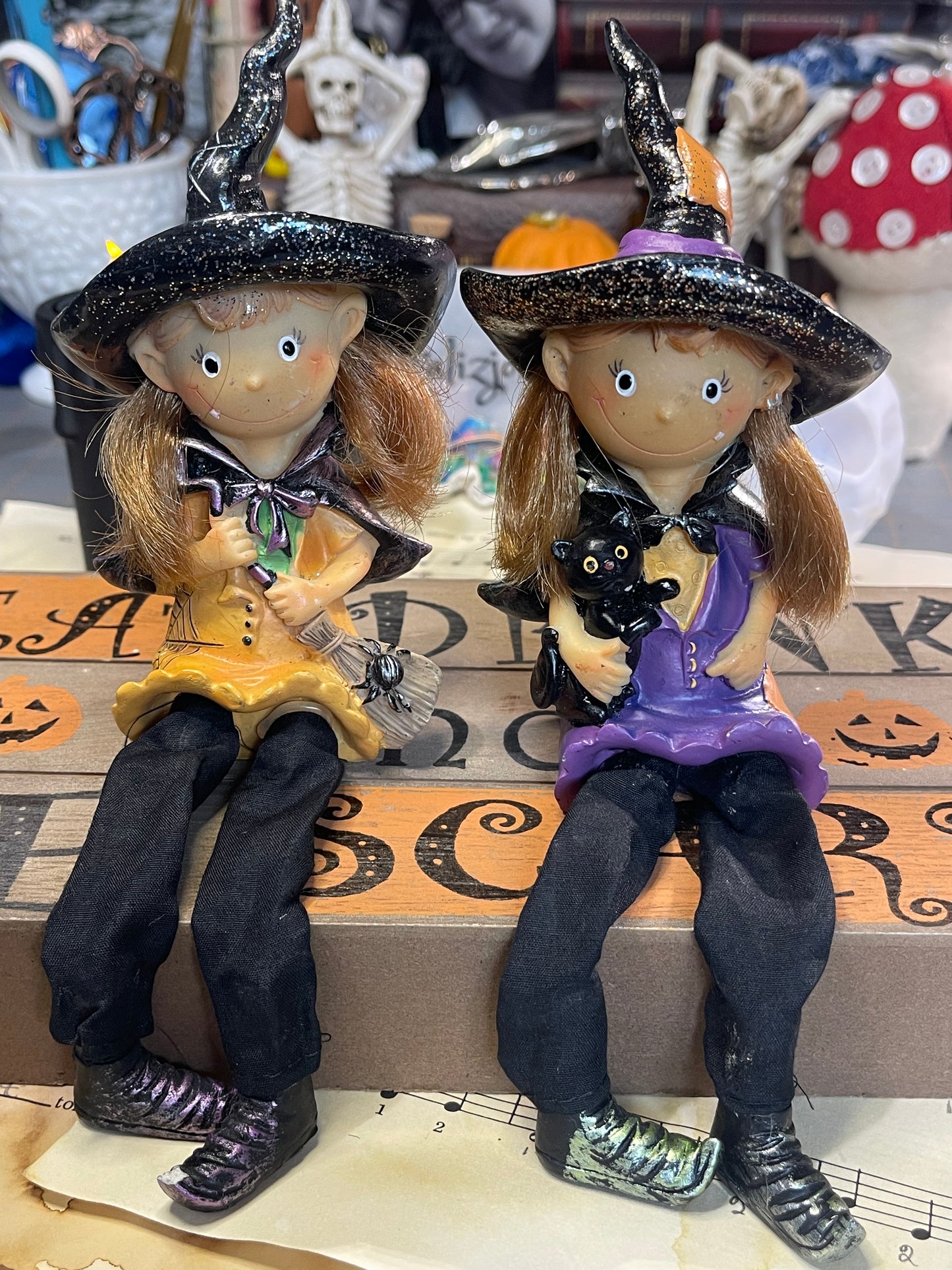 Cute Halloween witches with dangling legs