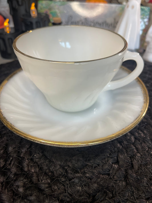 Milk, glass, teacup, and saucer