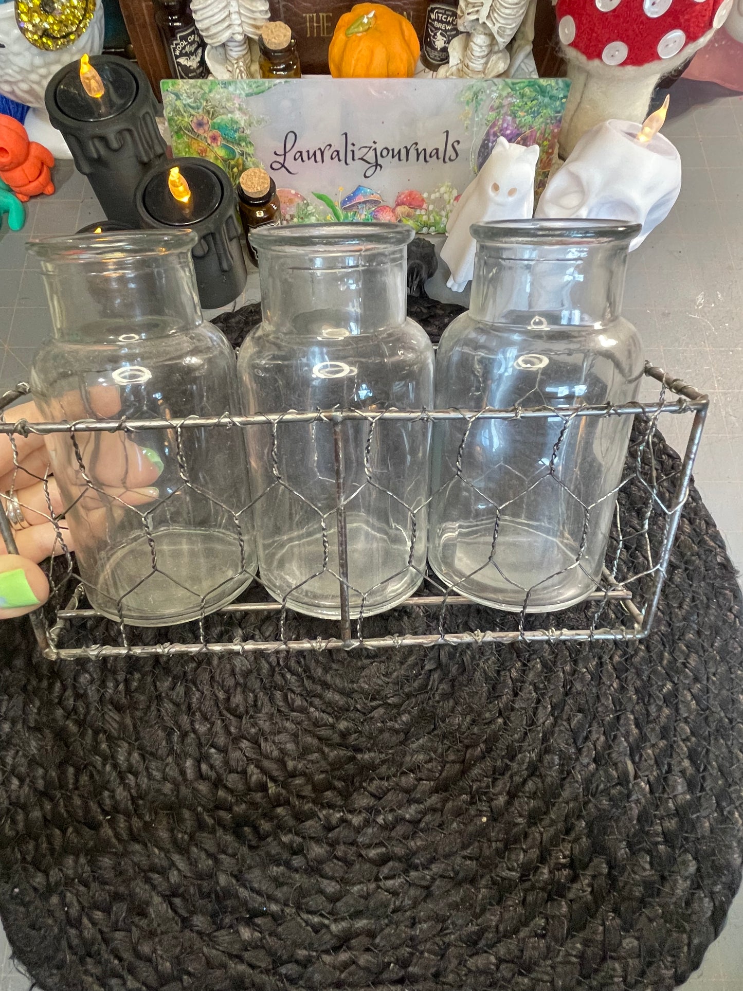 Set of clear vases in chicken wire basket