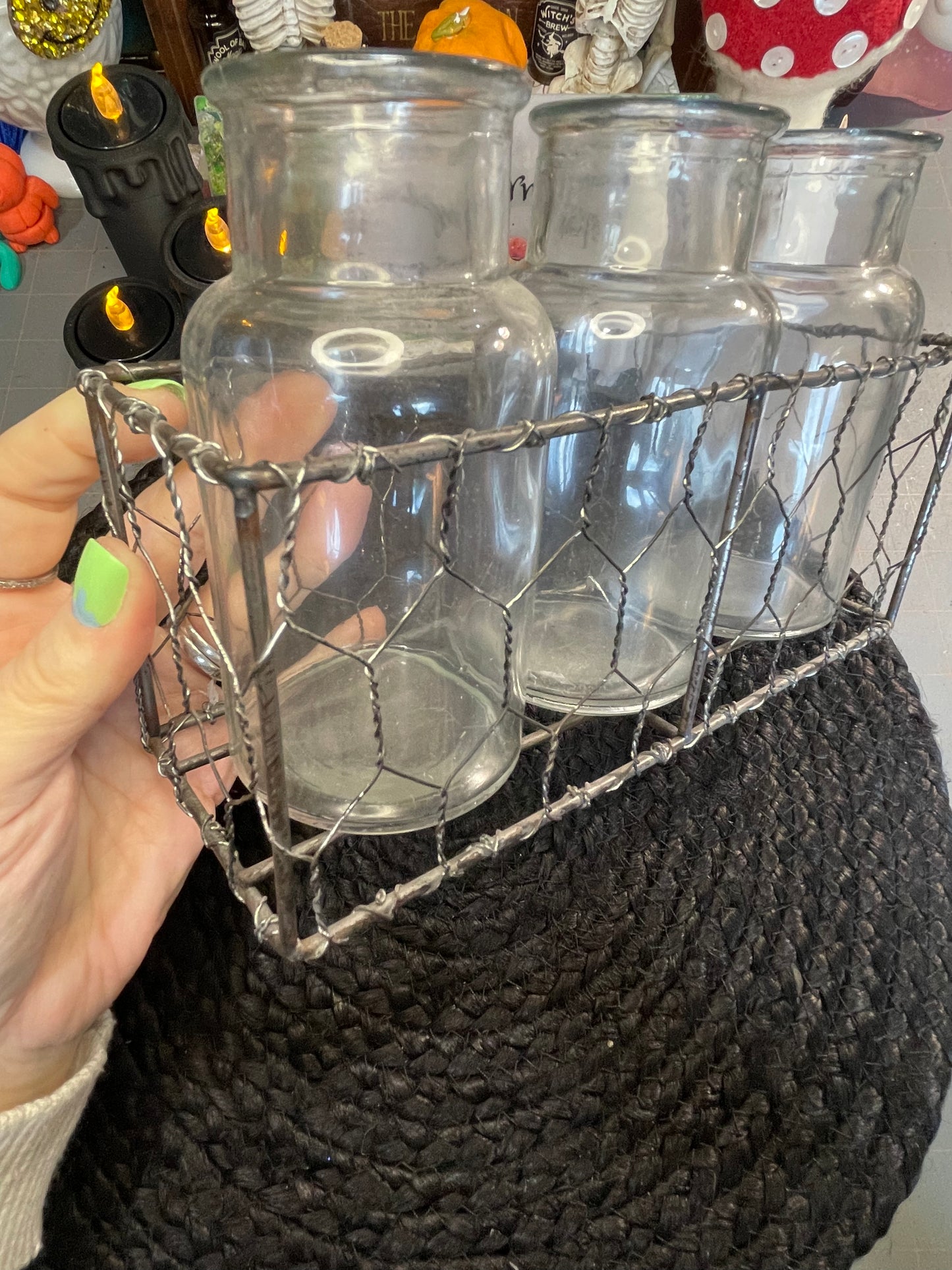 Set of clear vases in chicken wire basket