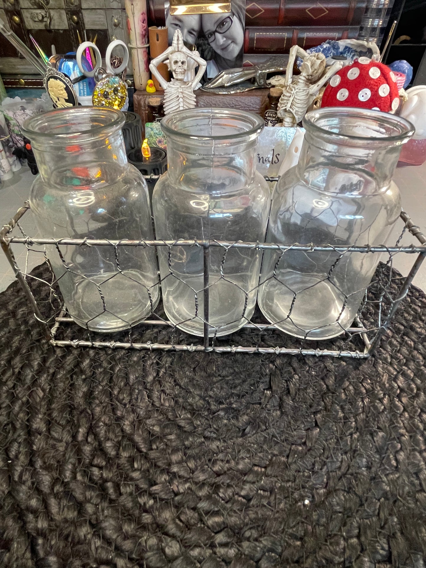 Set of clear vases in chicken wire basket