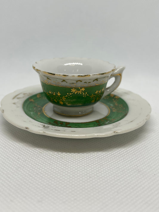 Demitasse hand painted green and gold cup and saucer