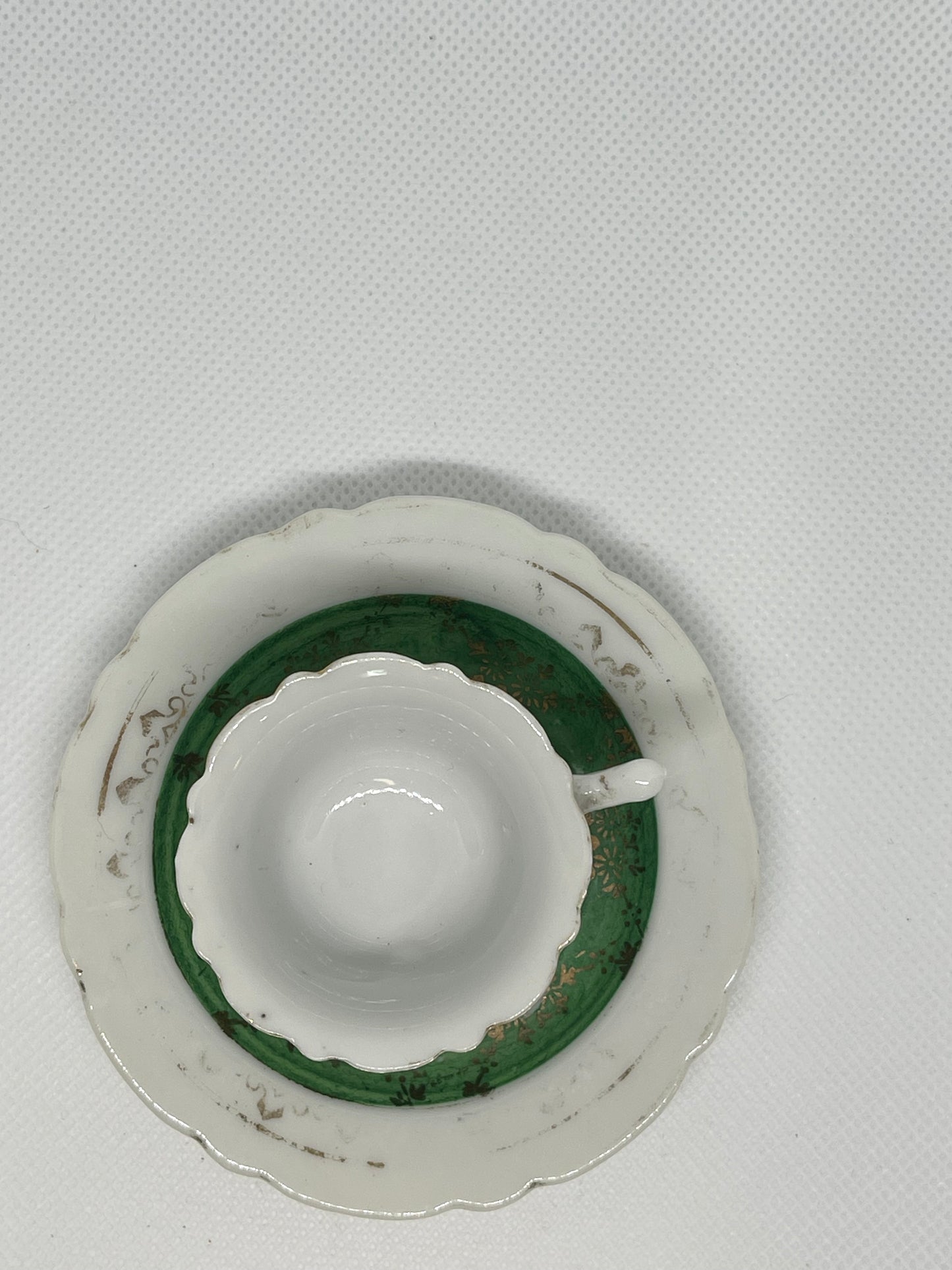 Demitasse hand painted green and gold cup and saucer